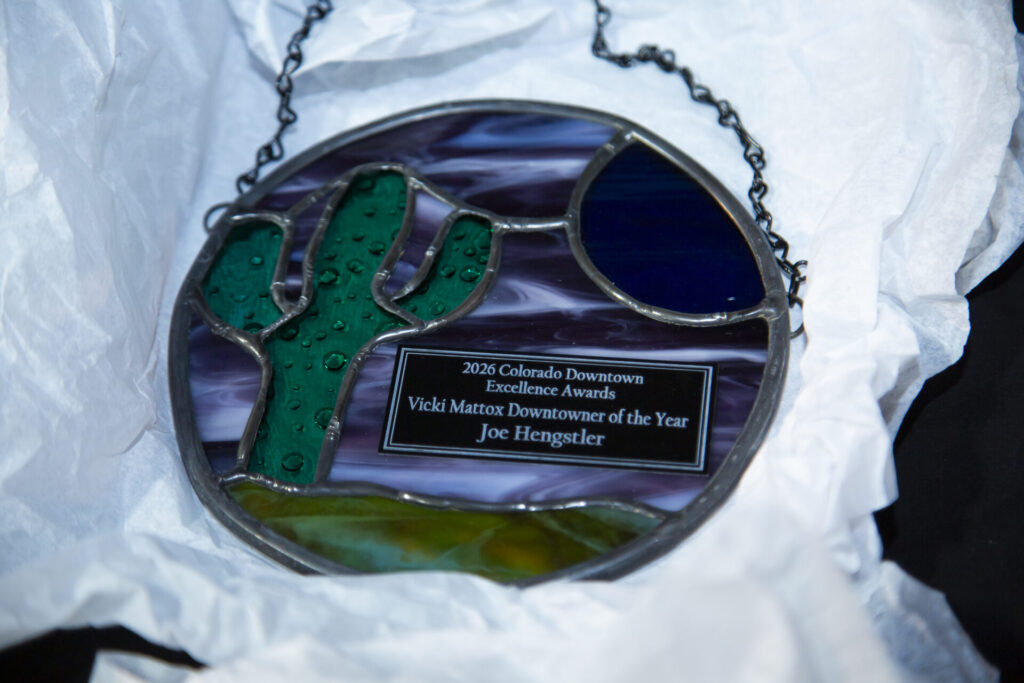 Stained glass award of a cactus and mesa, celebrating Joe Hengstler in 2026